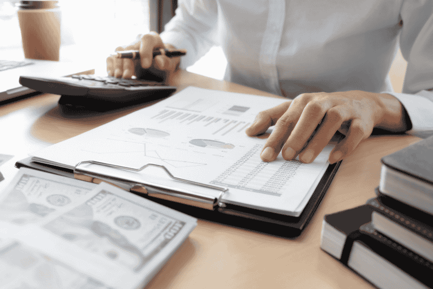 Reviewing bank statements and financial documents to identify hidden fees and unnecessary charges