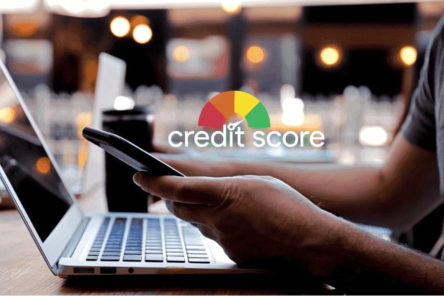 Checking credit score online with a visual gauge representing ideal credit utilization ratios in the US